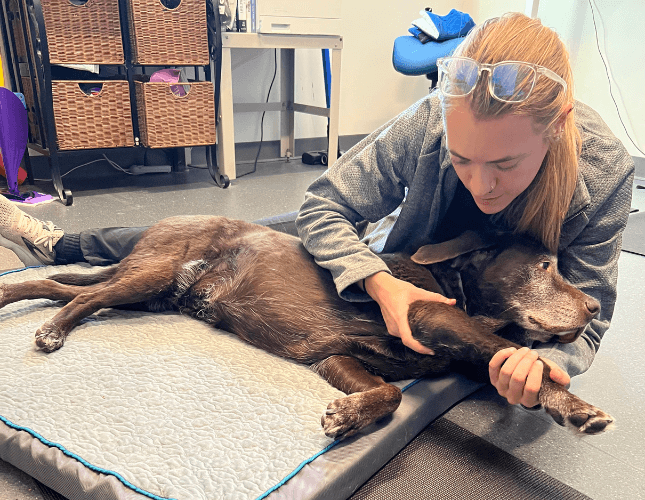 Dr. Grace helping a patient stretch