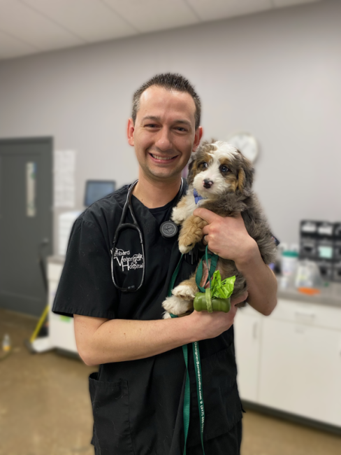 Dr. Cornell holding a puppy